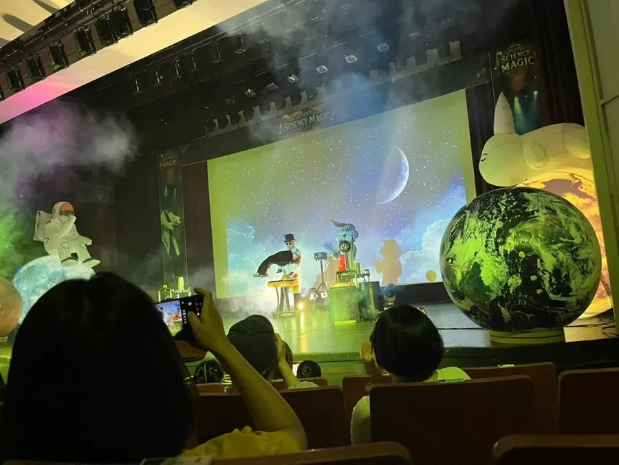 Magician JT performing a science magic act
