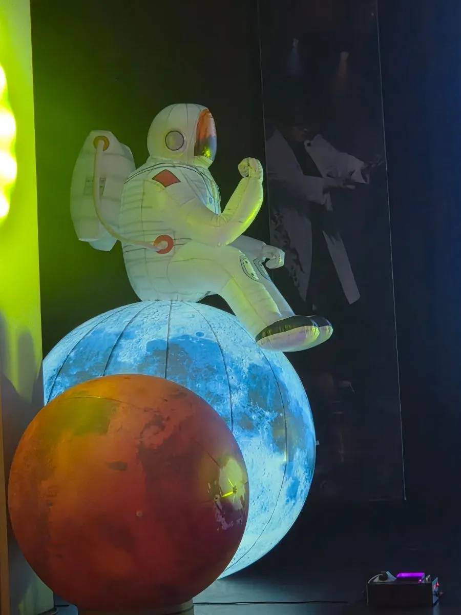 Large planet prop set up beside the stage