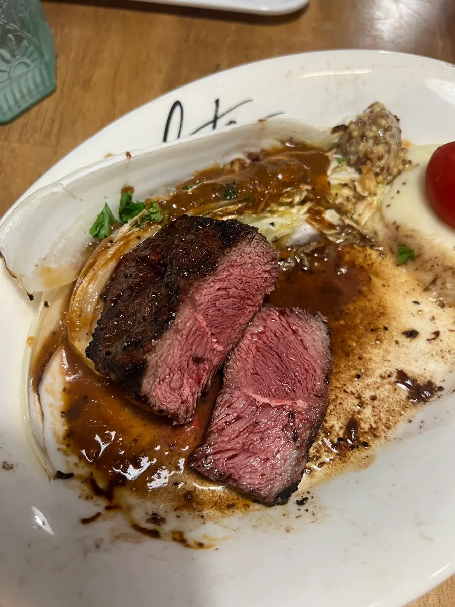 Fanchal steak served with grilled cabbage and mashed potato