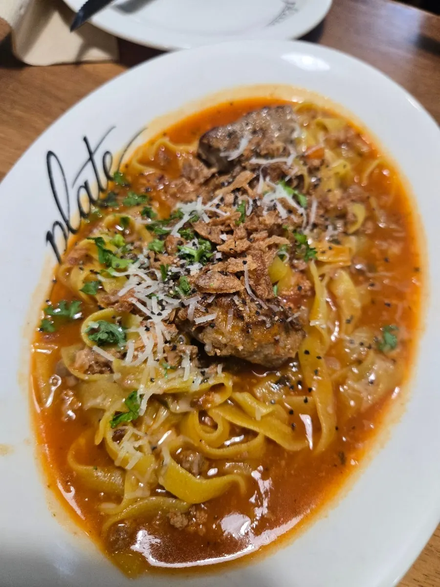 A plate of classic meatball bolognese