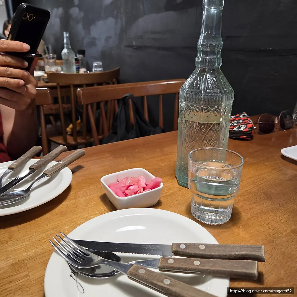 Table spread with pasta and steak together