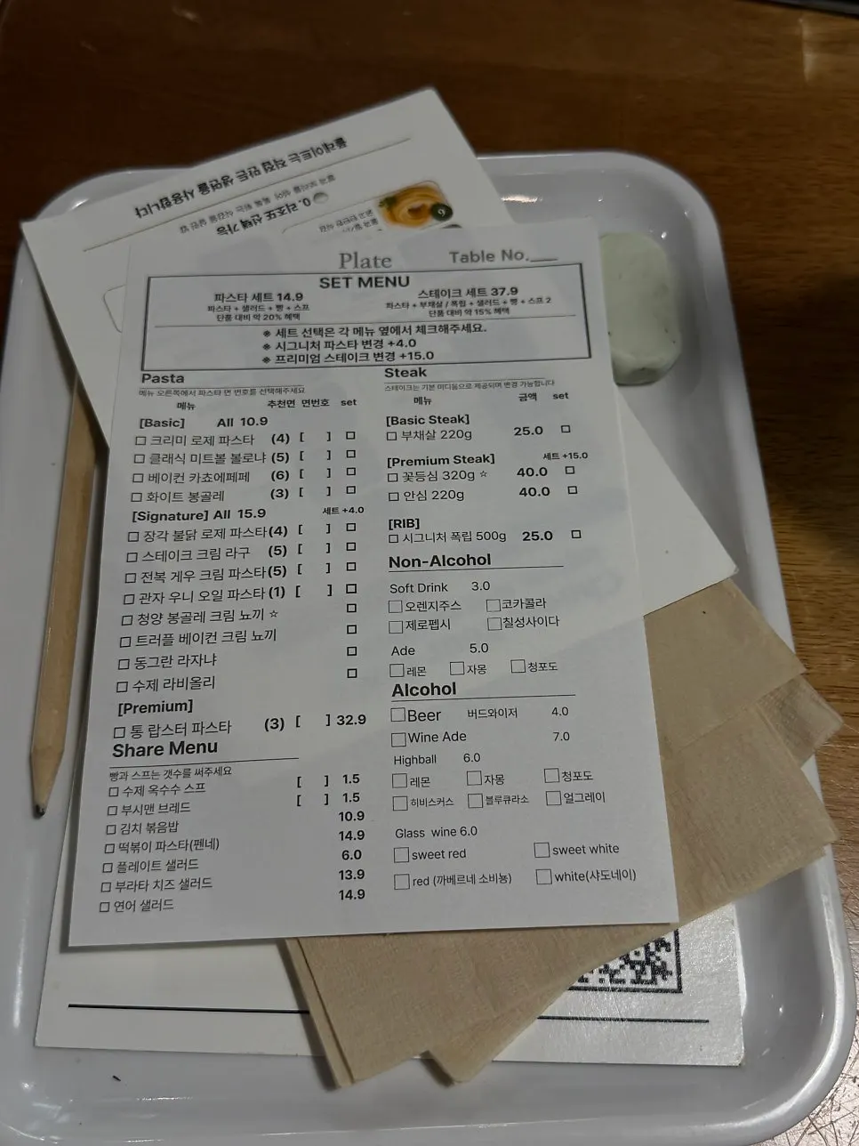 Paper menu listing noodle types