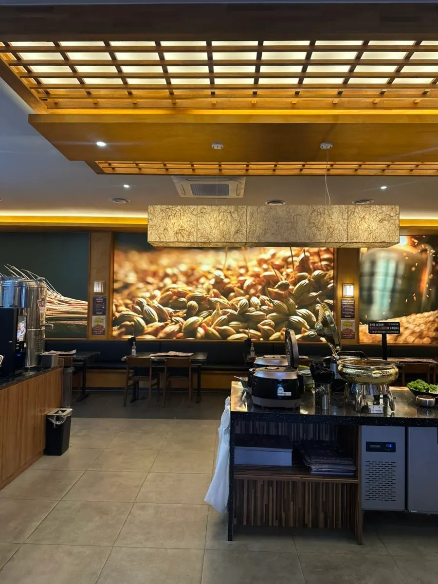 Self-serve banchan bar corner at Baengnyeon Boribap