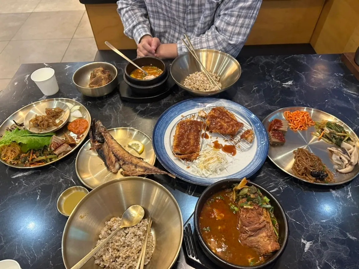 Table spread with two sets and full banchan