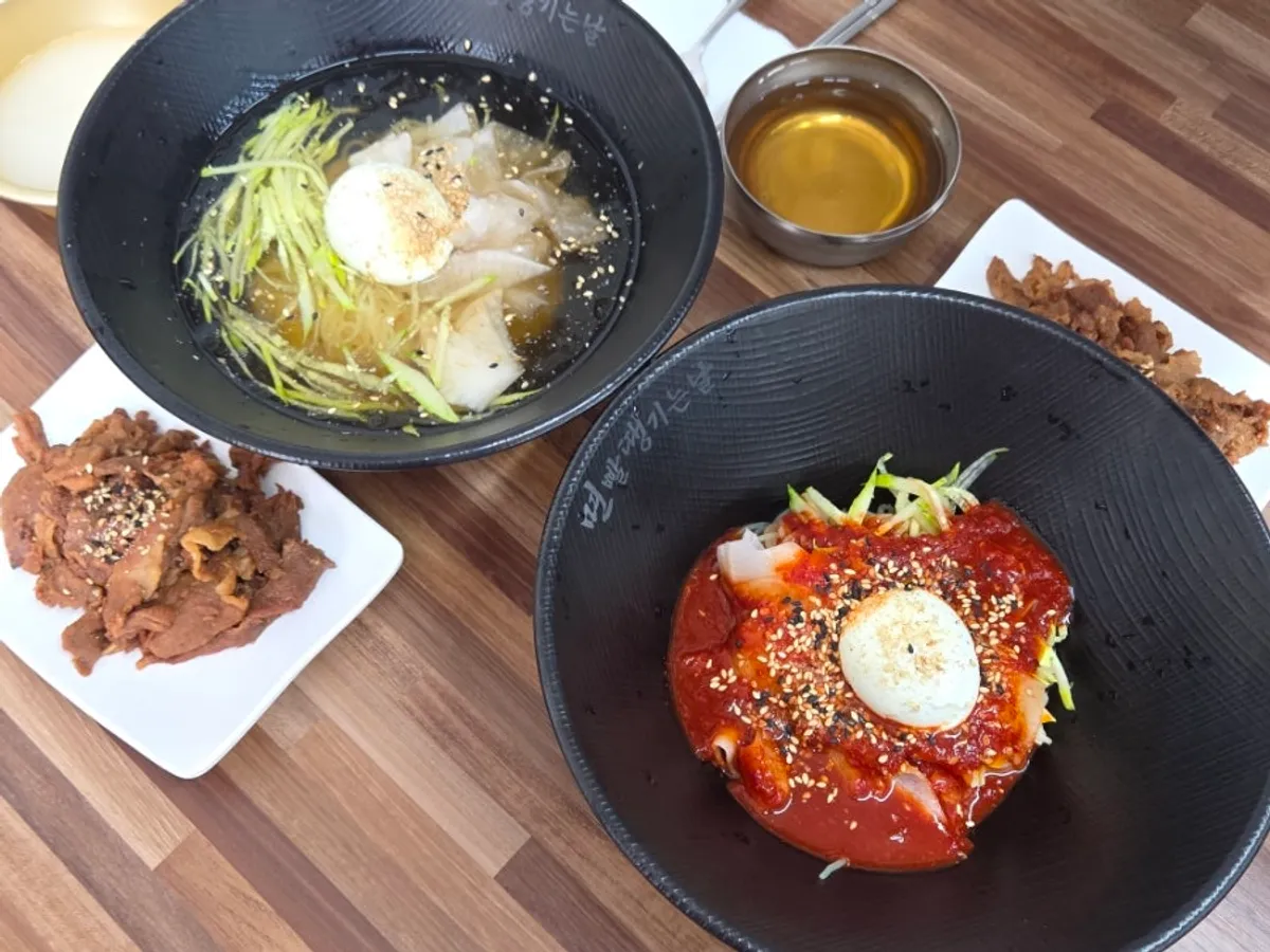 A full spread with milmyeon and charcoal grilled pork served together
