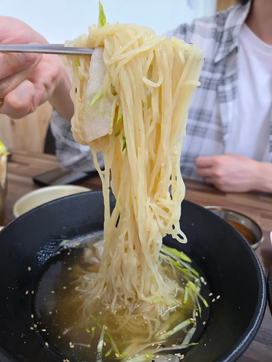 Chewy milmyeon noodles paired with charcoal grilled pork