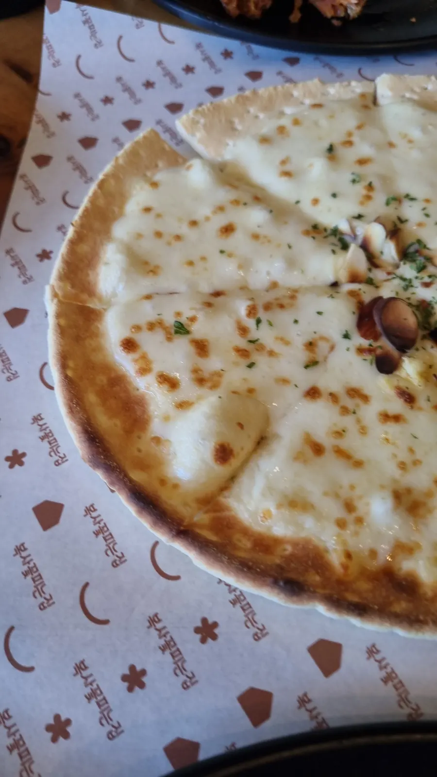 Margherita pizza served with the fire-grilled menu order