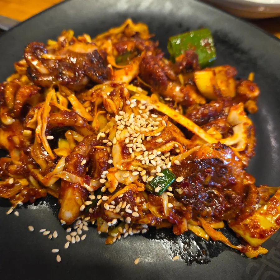 A glass of soju-beer mix alongside the spicy fire-grilled dishes