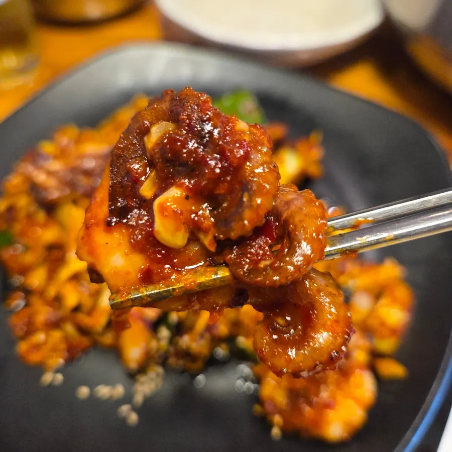 Close-up of the smoky fire-grilled octopus stir-fry