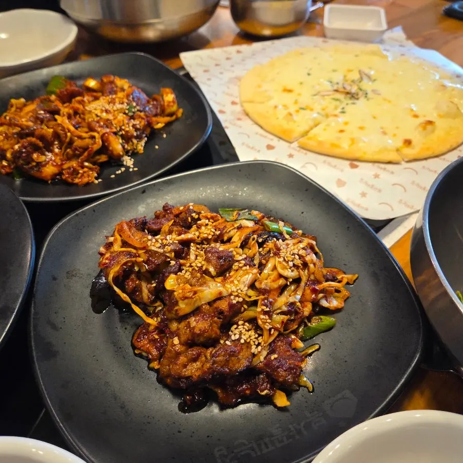 A single serving plate of fire-grilled octopus stir-fry