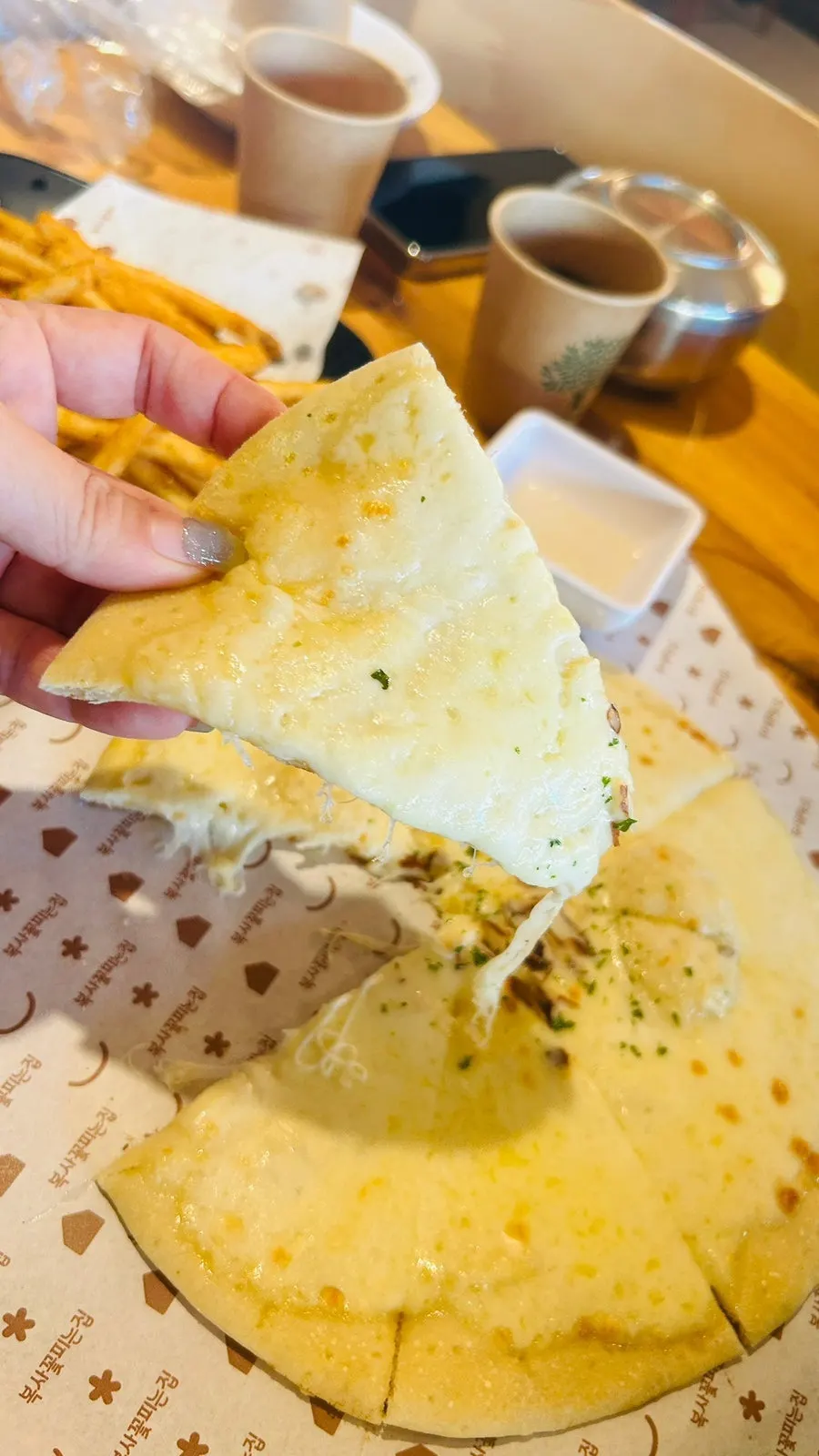A slice of gorgonzola pizza piled with cheese