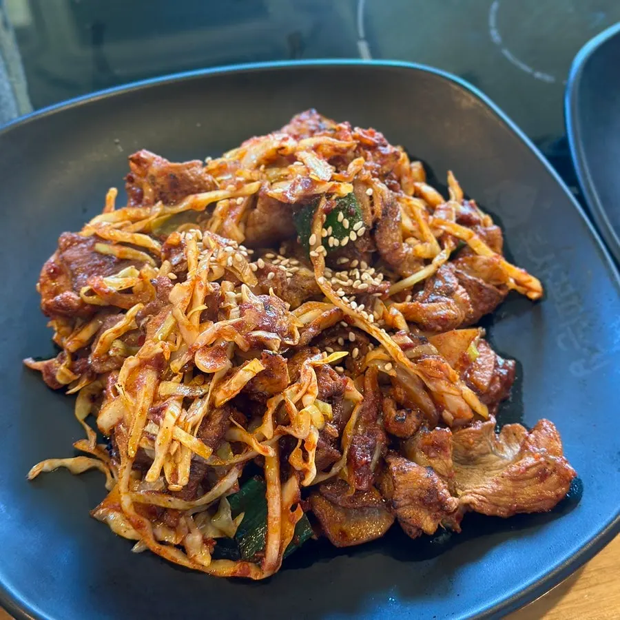 Fire-grilled octopus stir-fry at spice level 2
