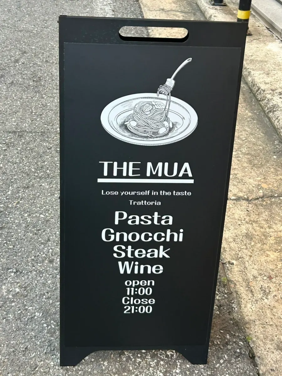 THE MUA entrance with business hours sign