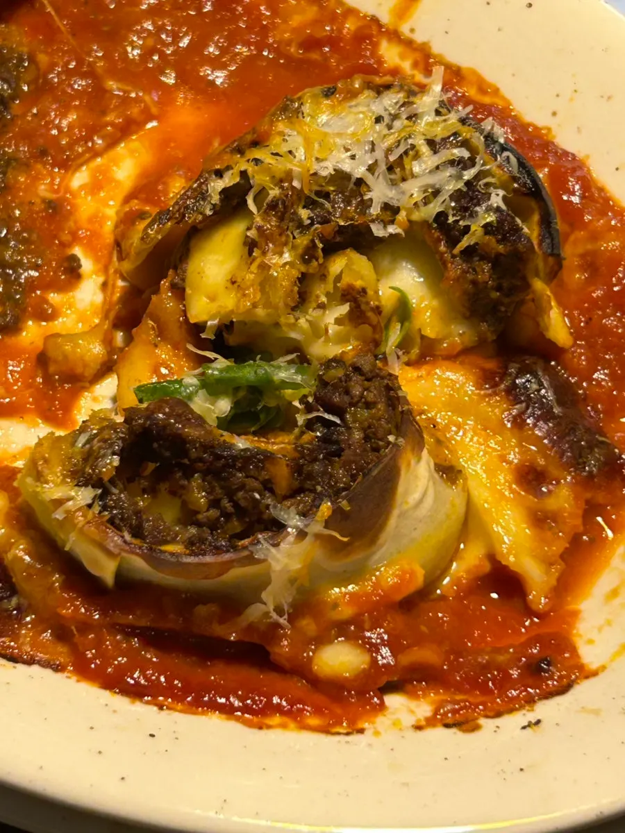 Cross-section of lasagna packed with cheese and hanwoo ragu