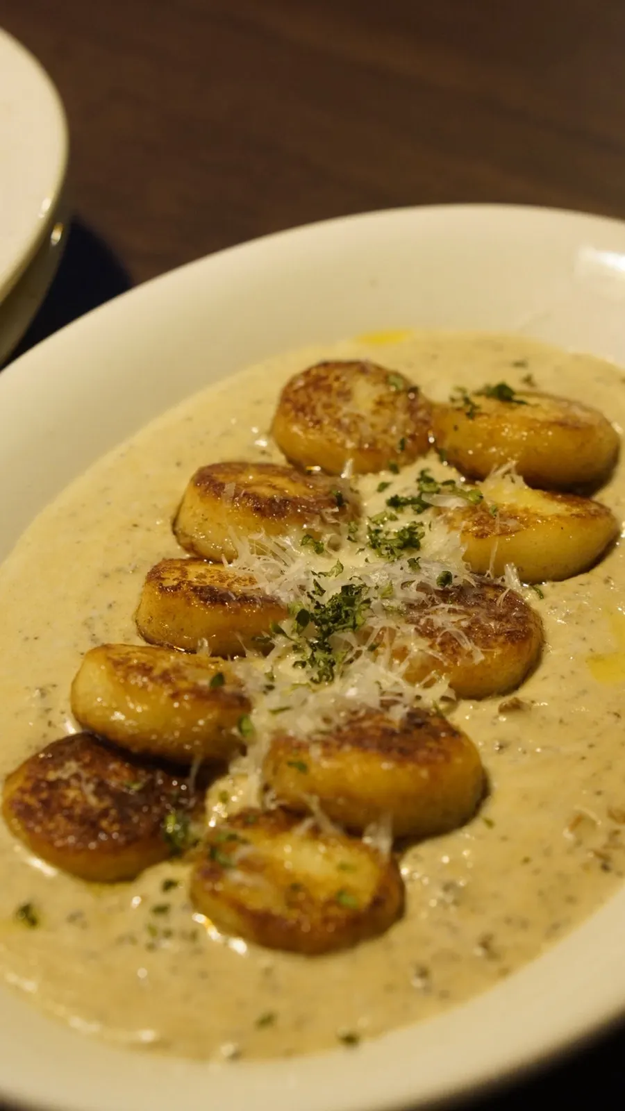 Close-up of gnocchi in mushroom sauce