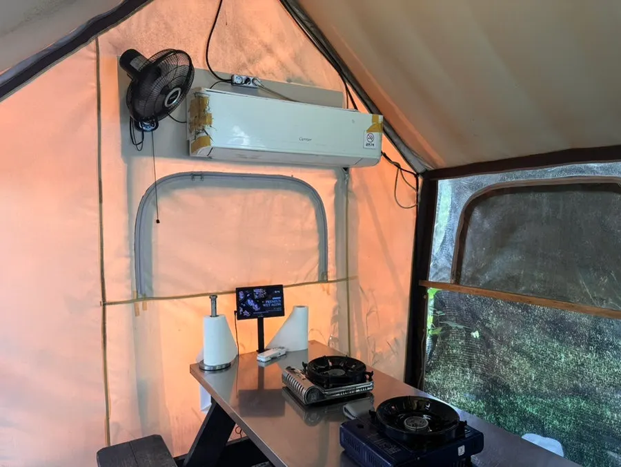Tent seating with table and grill