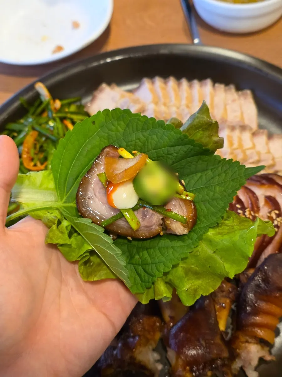 Jokbal wrapped in lettuce and perilla leaf