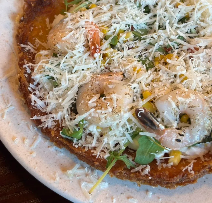 Potato pancake with garlic sauce and hot sauce
