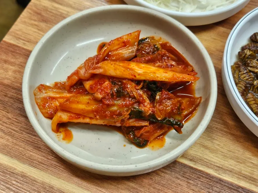 Kimchi and side dishes served as part of the basic spread