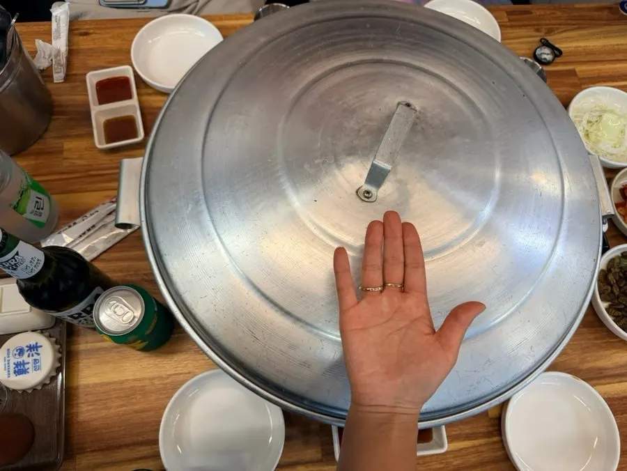Table set with side dishes and the large hot pot