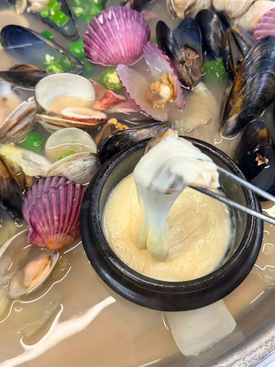 Opened clam hot pot for two with various seafood