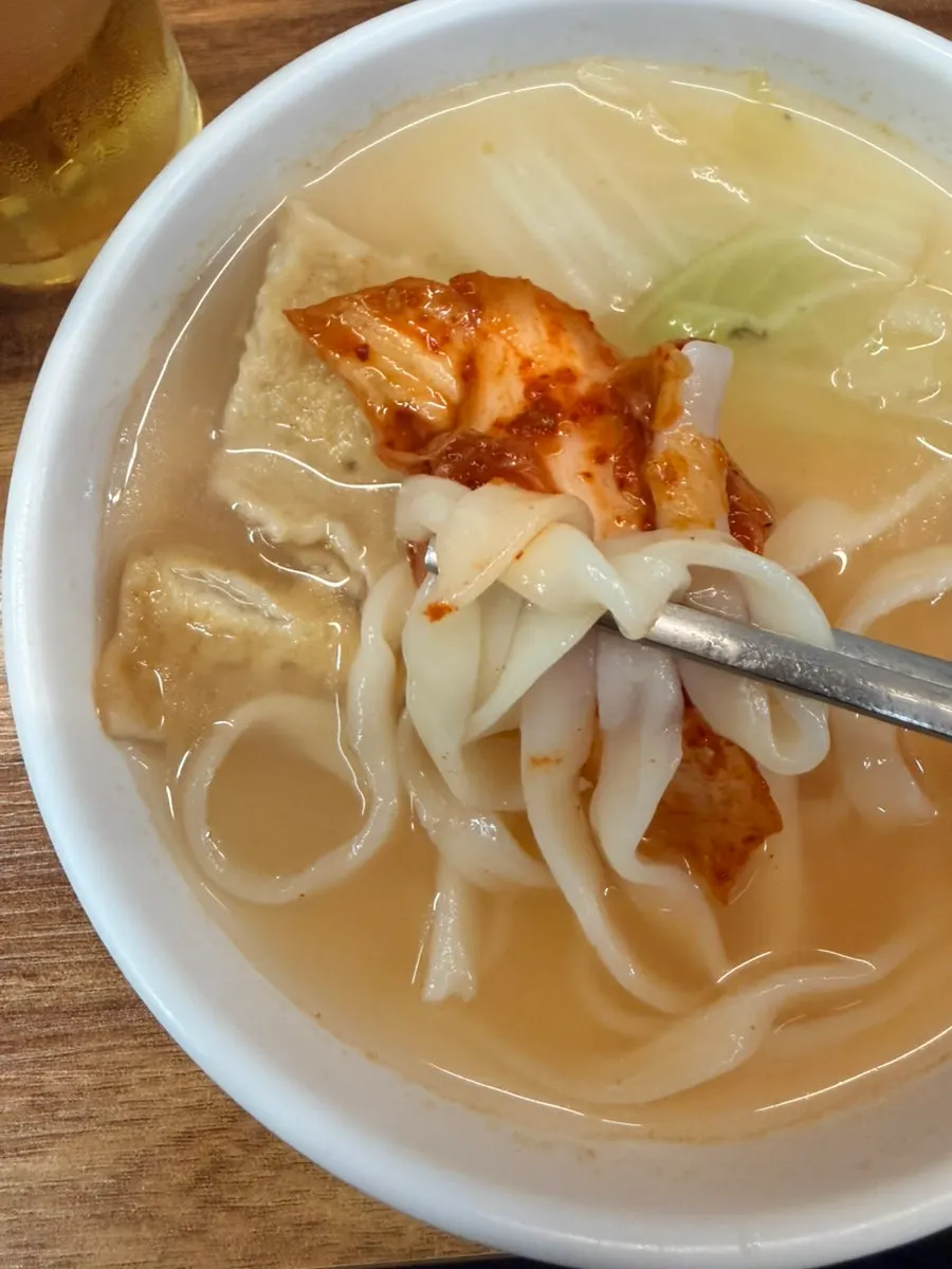 Deeply infused clam broth with kalguksu noodles added