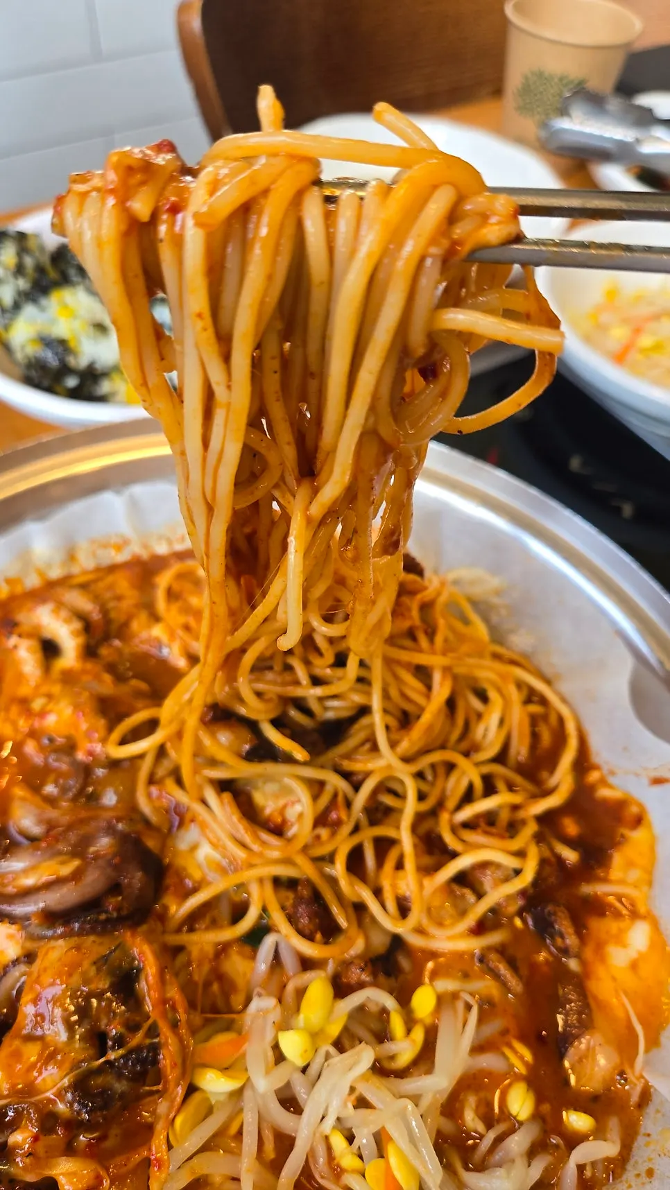 A bite of webfoot octopus tossed in cheese sauce