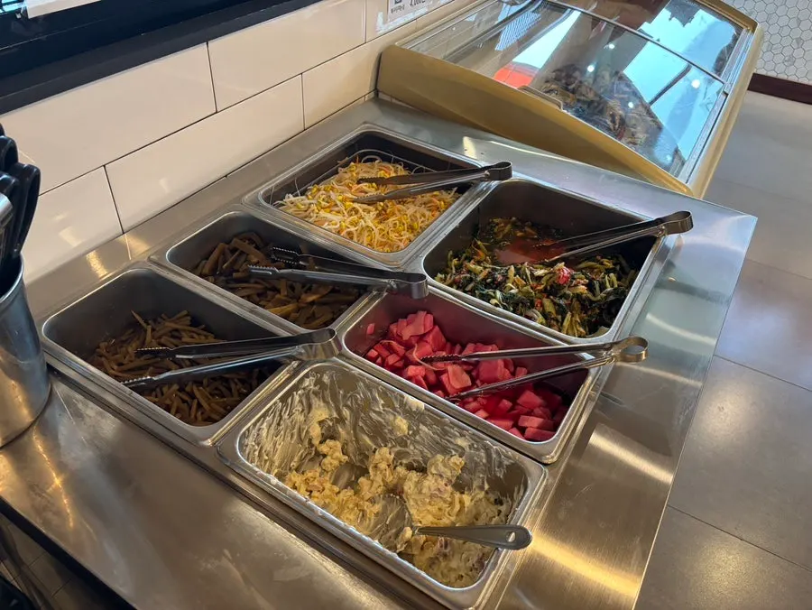 Japchae and other rice side dishes at the self-bar