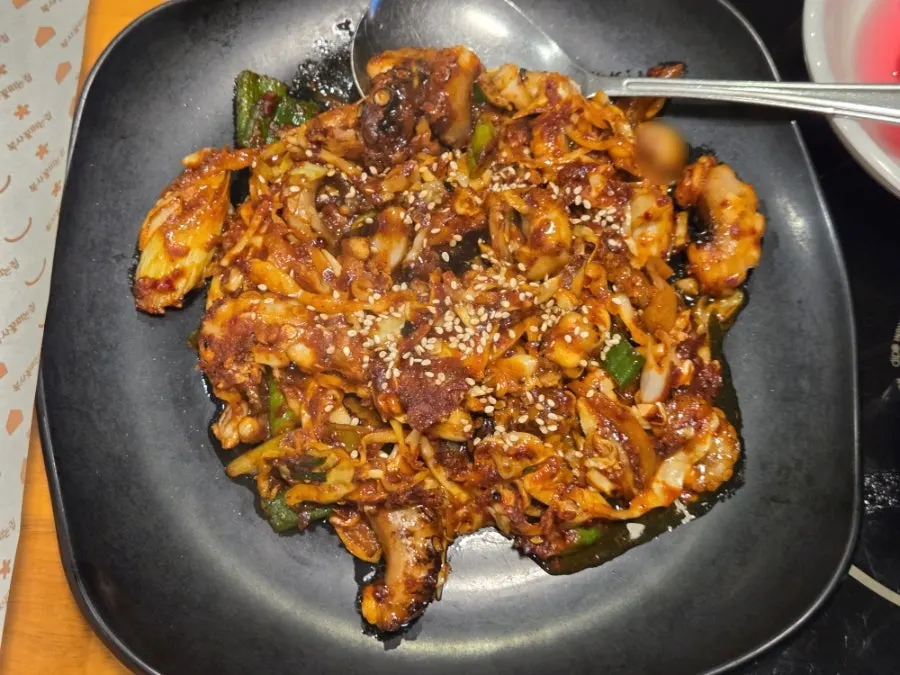 Gorgonzola pizza and fire-grilled octopus stir-fry spread