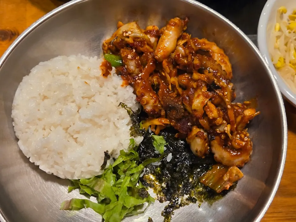 Close-up of smoky fire-grilled octopus stir-fry