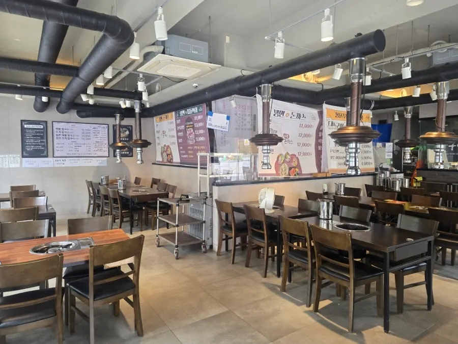 Interior of the kalguksu restaurant with many tables