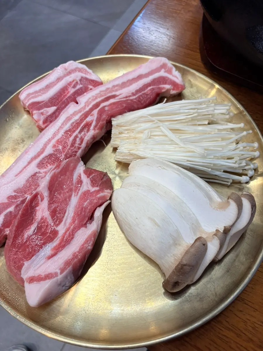 Raw Berkshire K pork belly and pork neck set on the table