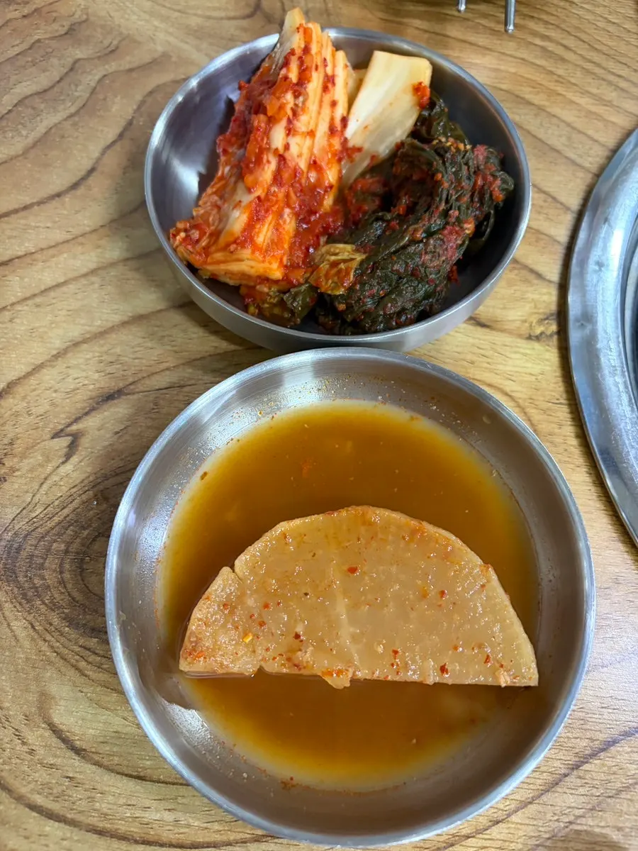 Basic side dishes served at Daemyeong Suran
