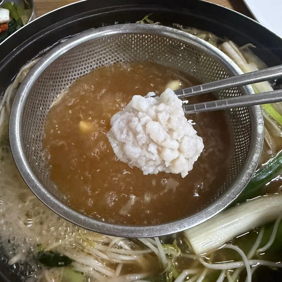 Pot of hamo shabu-shabu mid-meal