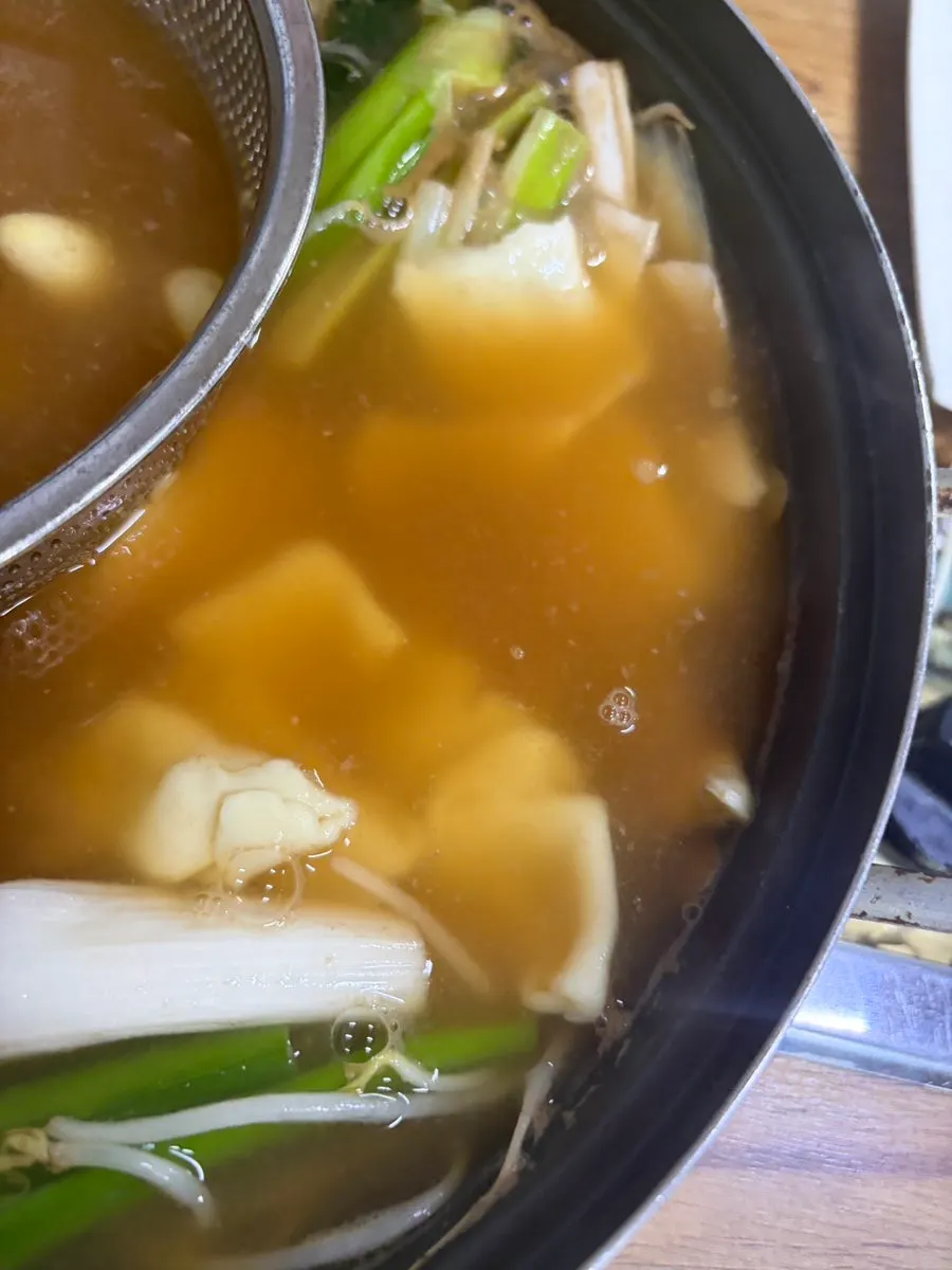 Broth infused with vegetables and hamo