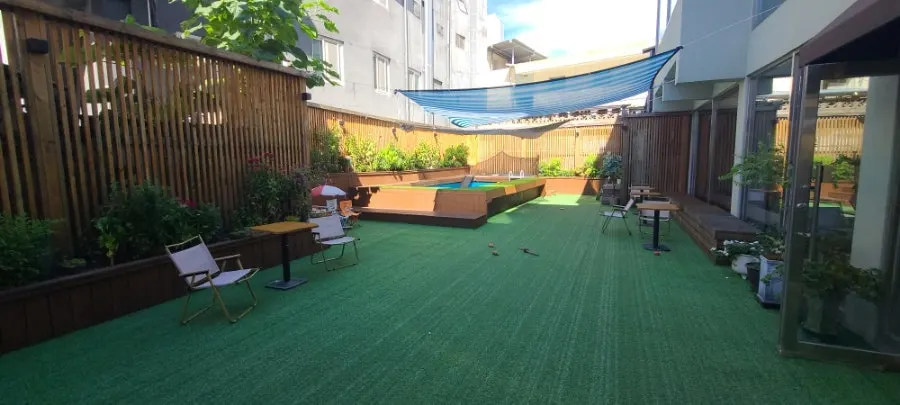 Outdoor play area with mat flooring