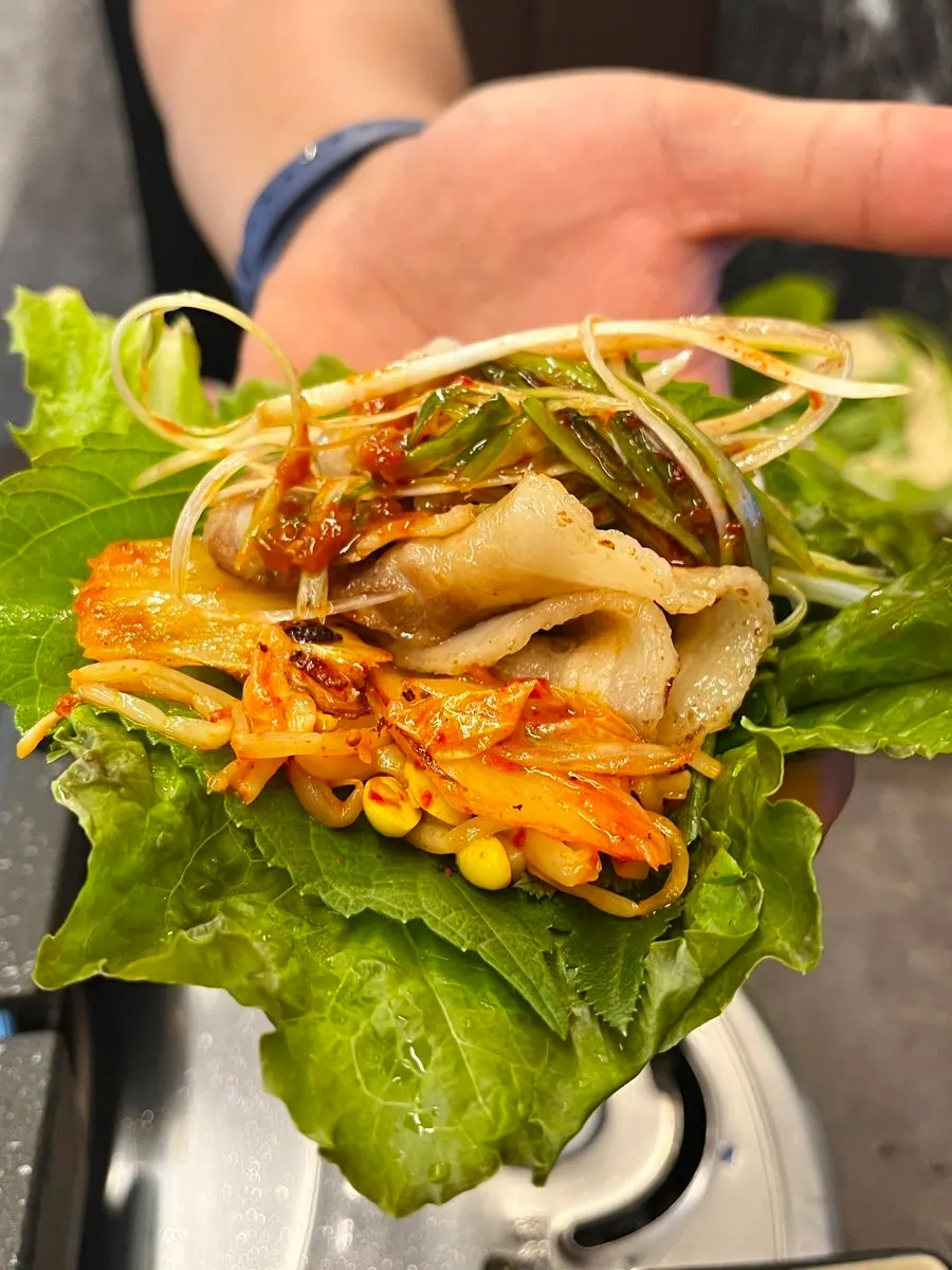 A lettuce wrap piled high with ingredients