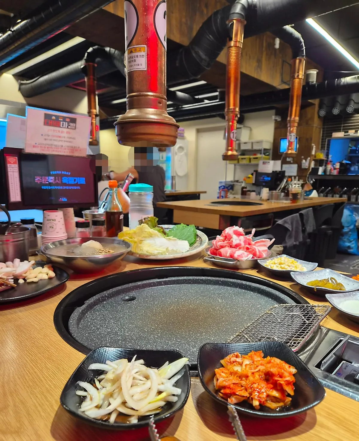 A plate of wrap vegetables and side dishes gathered from the self-serve bar