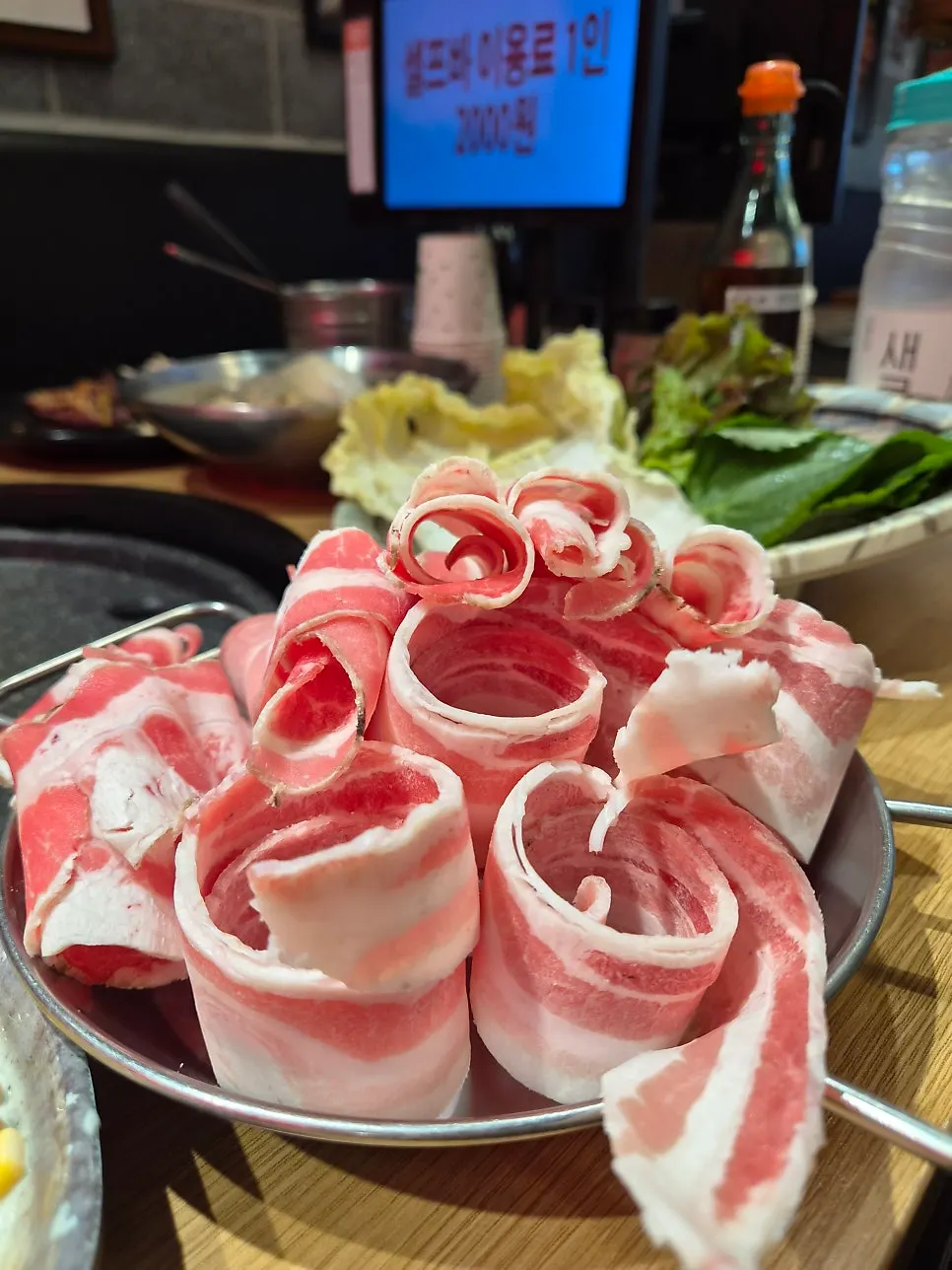 Plates of three cross-ordered thin-sliced meat cuts