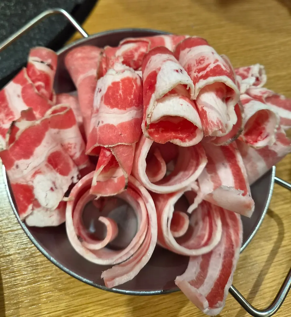 Dry-aged pork neck cut to 3mm thickness