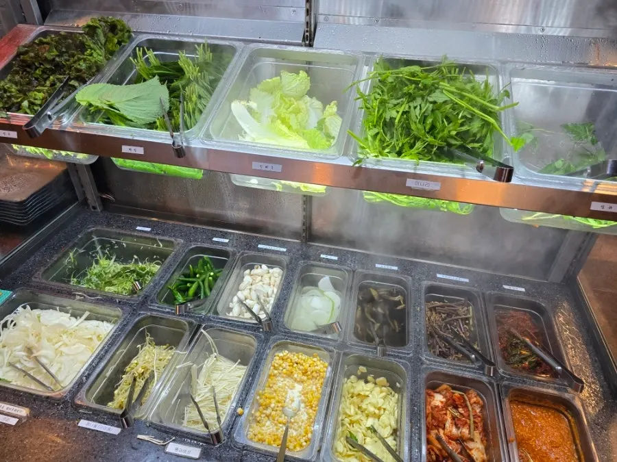 Self-serve bar stocked with kimchi and side dishes
