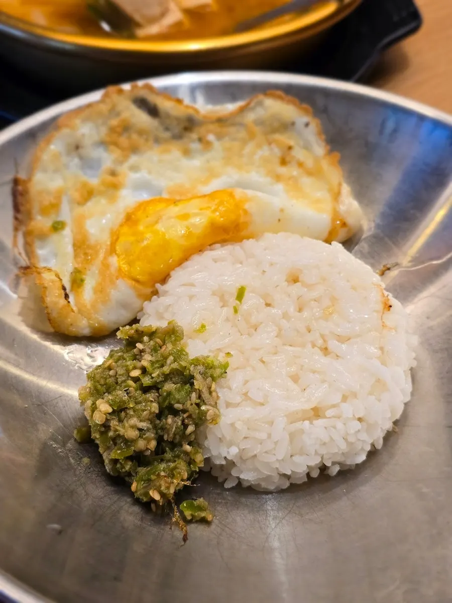 Spicy chili rice topped with a sunny-side-up egg