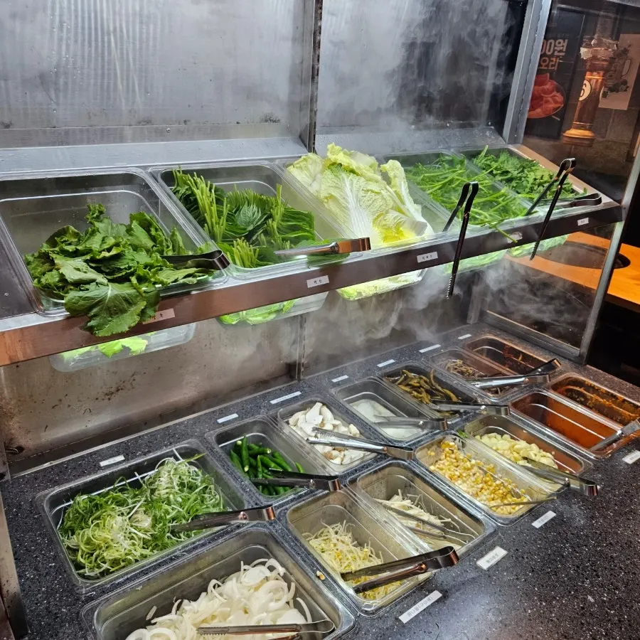 Lettuce, perilla leaves, shredded green onion and other self-serve bar ingredients