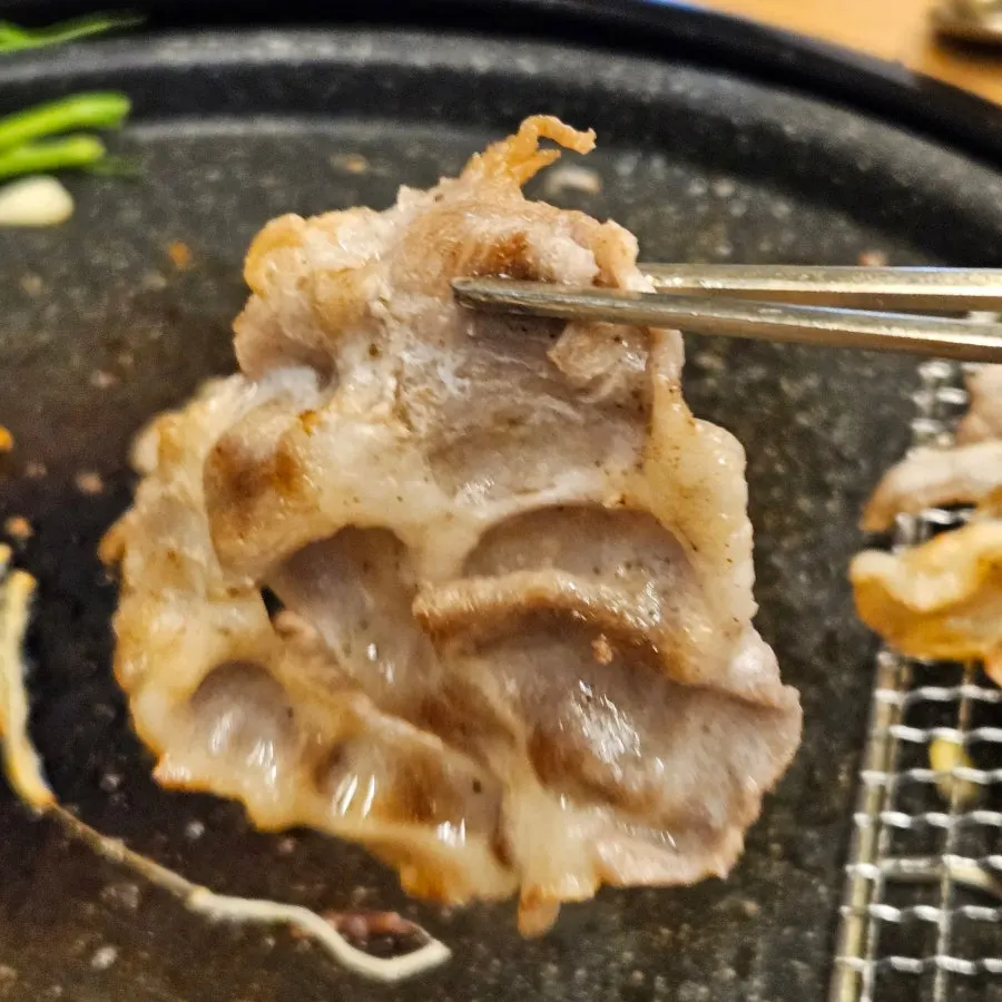 Full spread of sliced pork with wrap vegetables