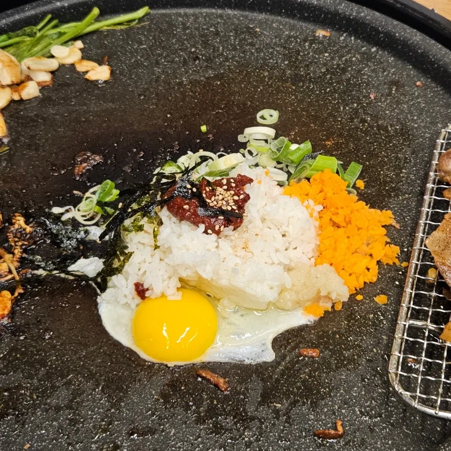 Rice, egg and seaweed flakes prepared for self-serve fried rice