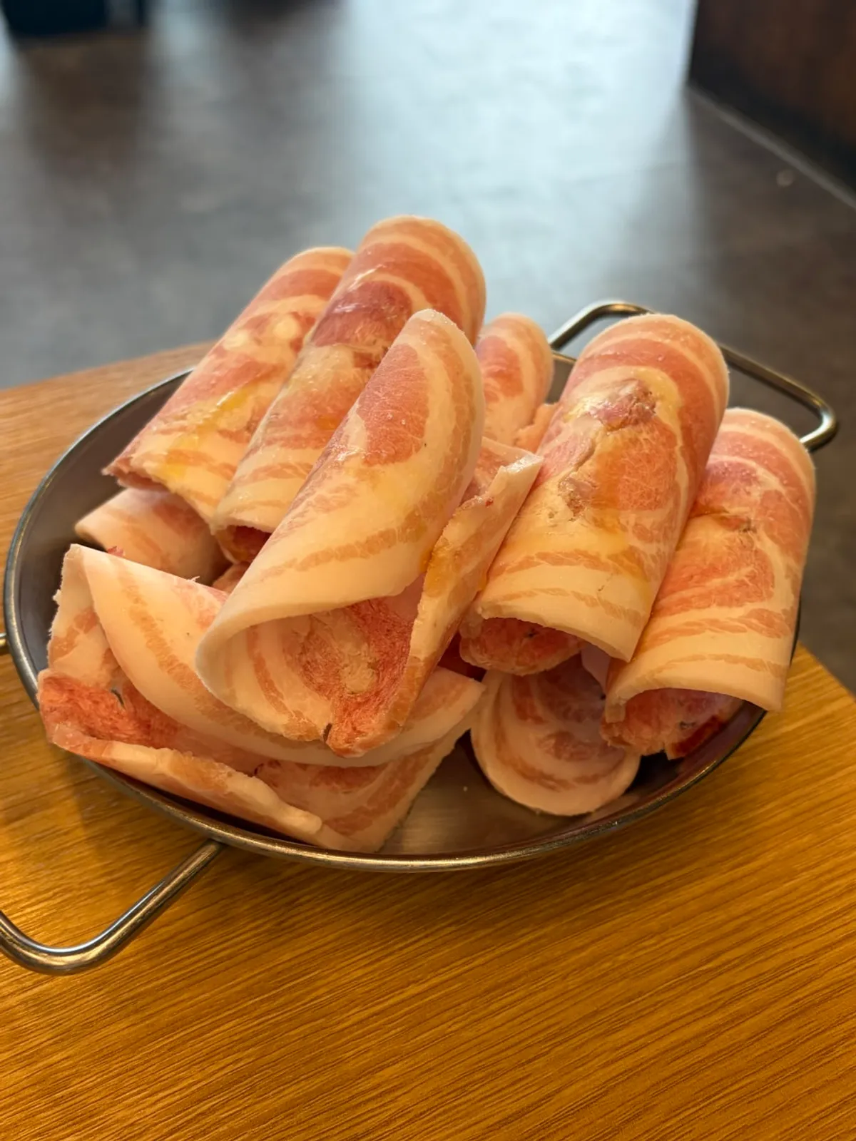 Sign listing prices for shaved pork belly, duck, and beef brisket