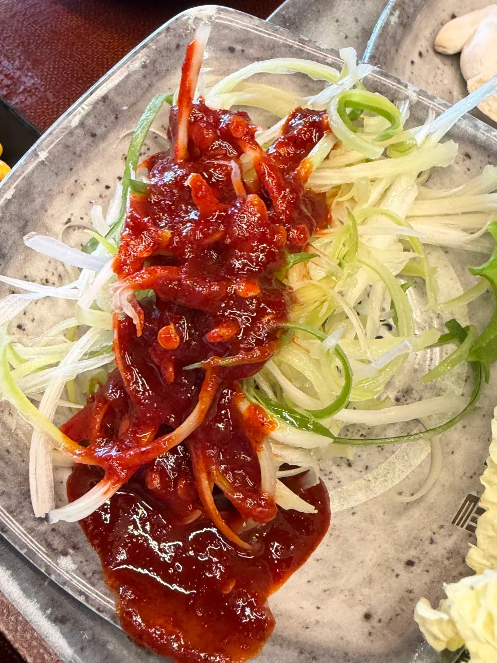 Shredded onion prepared at the self-serve bar