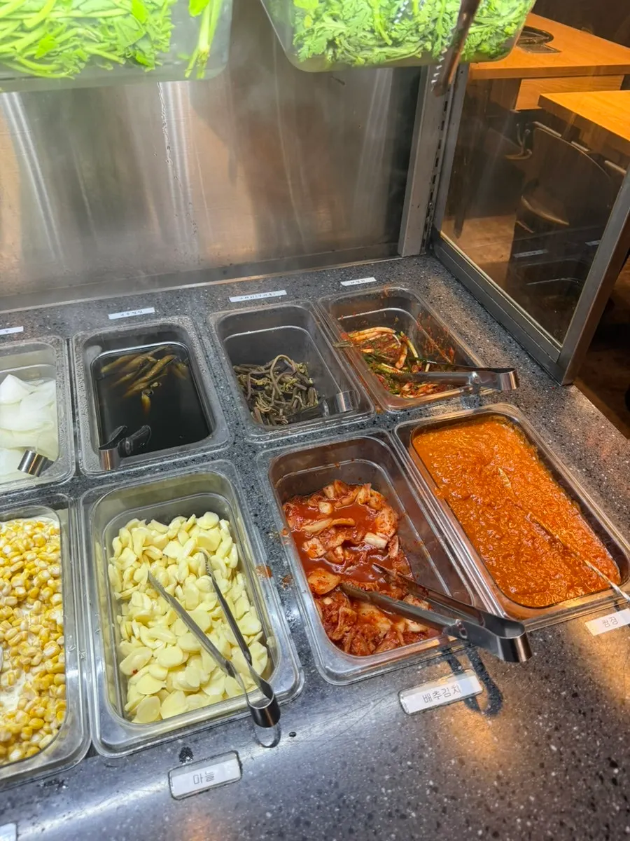 Self-serve bar with lettuce wraps and kimchi varieties