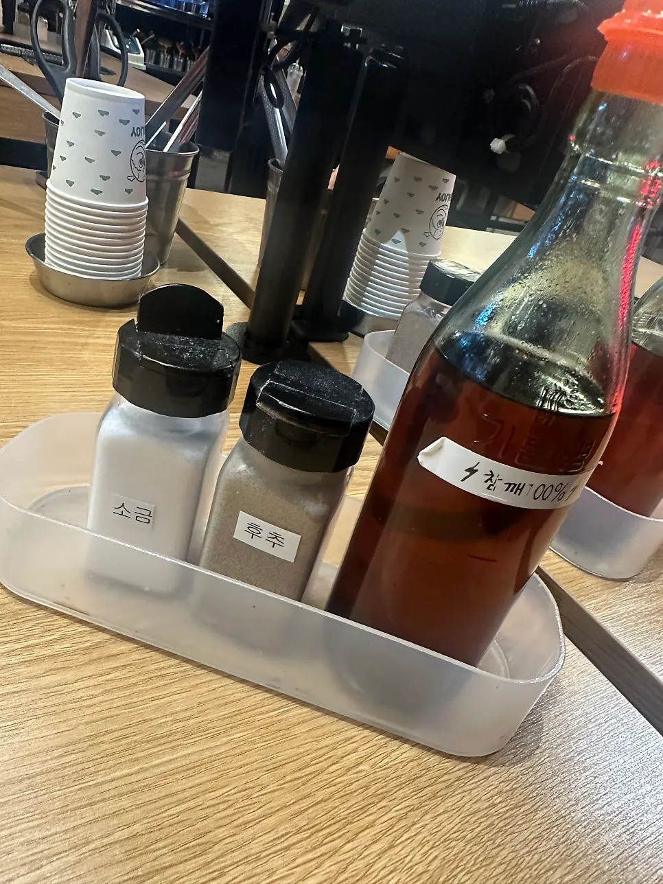 Salt, pepper, and sesame oil set on the table