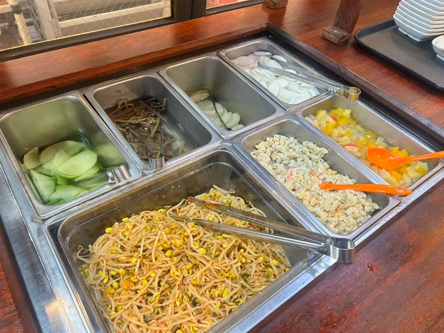 Daepae Sinhwa's dining hall with generously spaced tables